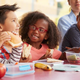 Children eating lunches on field trip
